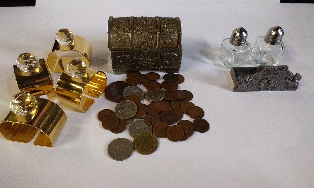 Lot 283: Mixed Lot Including 4x Brass Coloured Napkin Rings with Crystal, Metal Trinket Chest with selection of Various Coinage and a Pewter Dolly Parton's Dixie Stampede Salt and Pepper Holder