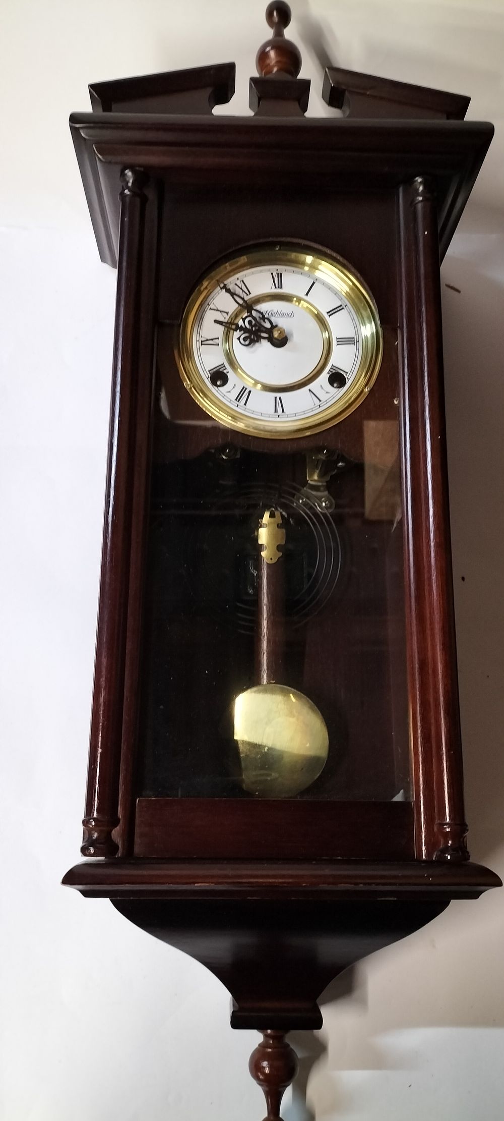 Lot 344: A Wooden Manual Wind Longcase Wall Clock with Key and Pendulum