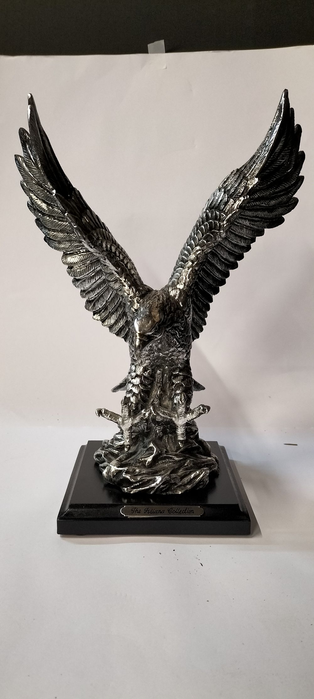 Lot 319: The Juliana Collection Eagle Landing Silver/Pewter Effect Resin Figurine on a Wooden Base