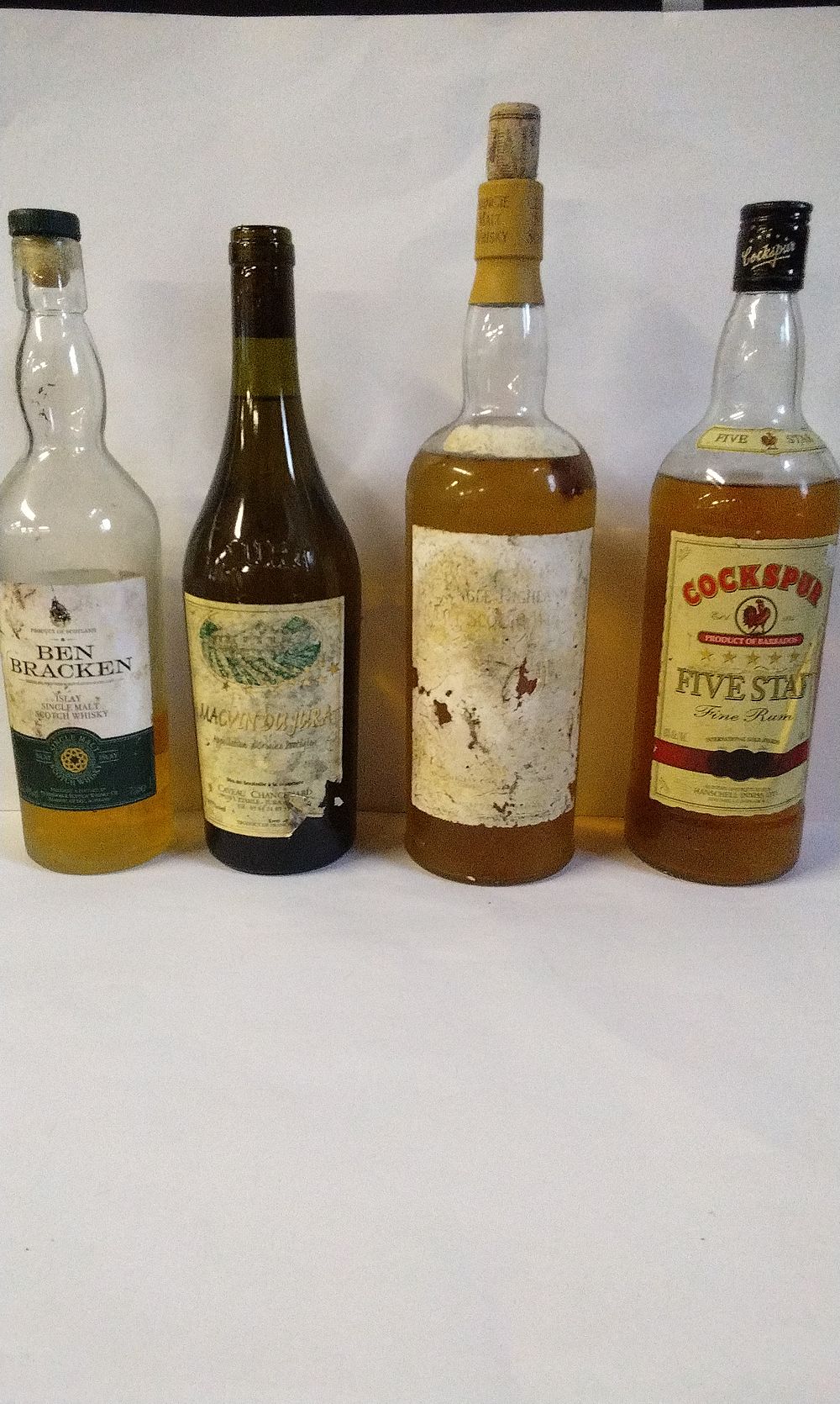 Lot 732: 3x Part Bottles of Whisky and a Bottle of Macvin DubJura White Wine