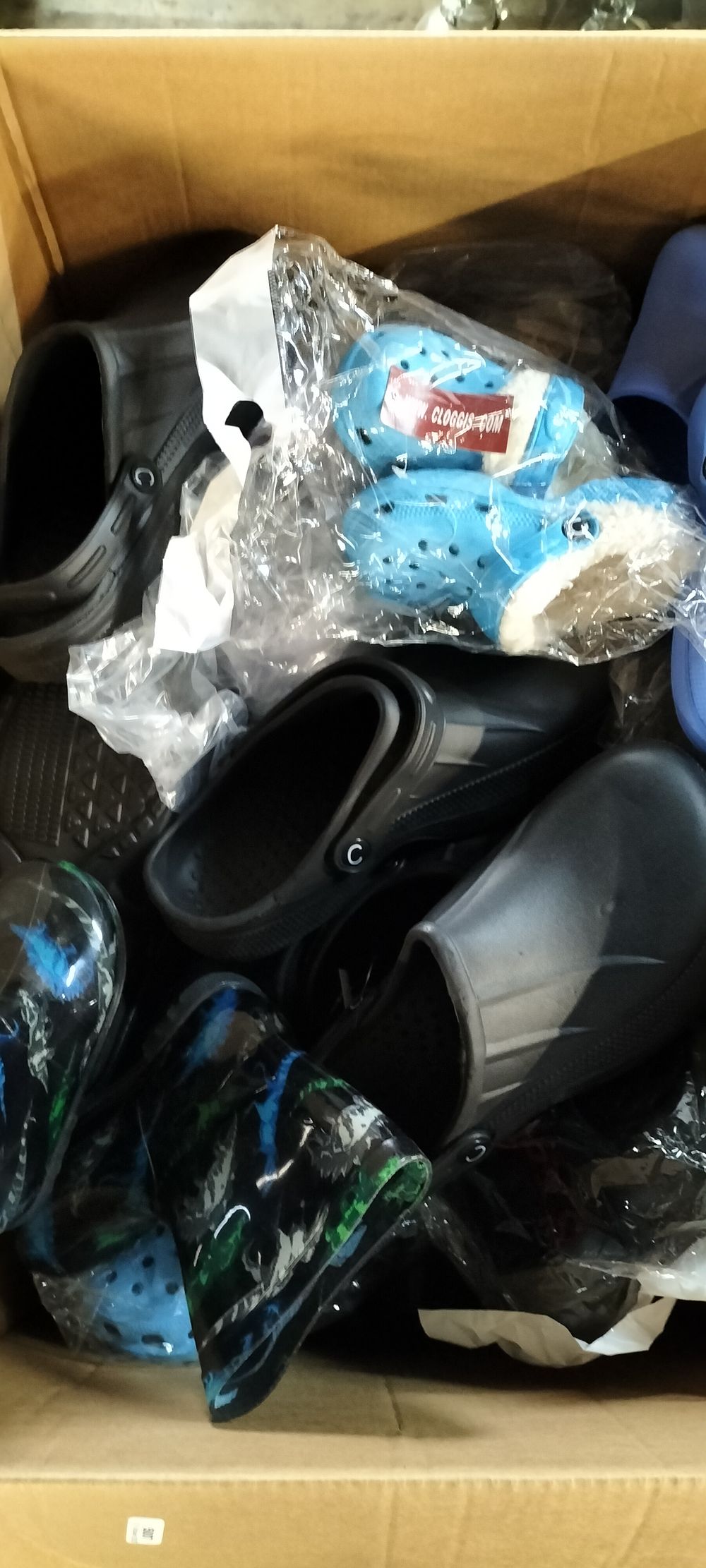Lot 749: A Large Box of Child and Adult Croc Style Footwear