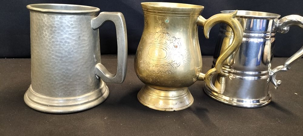 Lot 155: Three Tankards 2 Pewter and 1 Brass