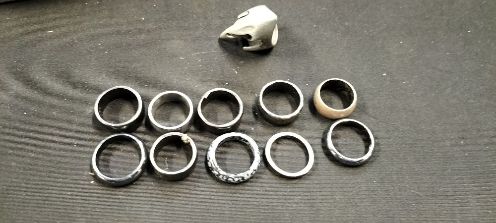 Lot 158: Eleven Rings of Various Sizes and Materials Including a Raven Skull Ring