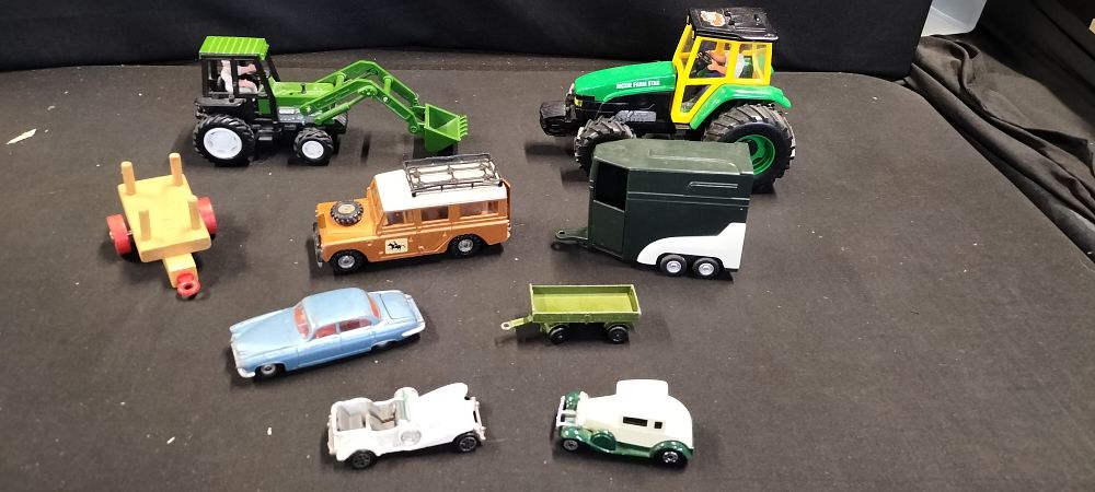 Lot 165: A Total of 9 Die Cast and other Vehicles.