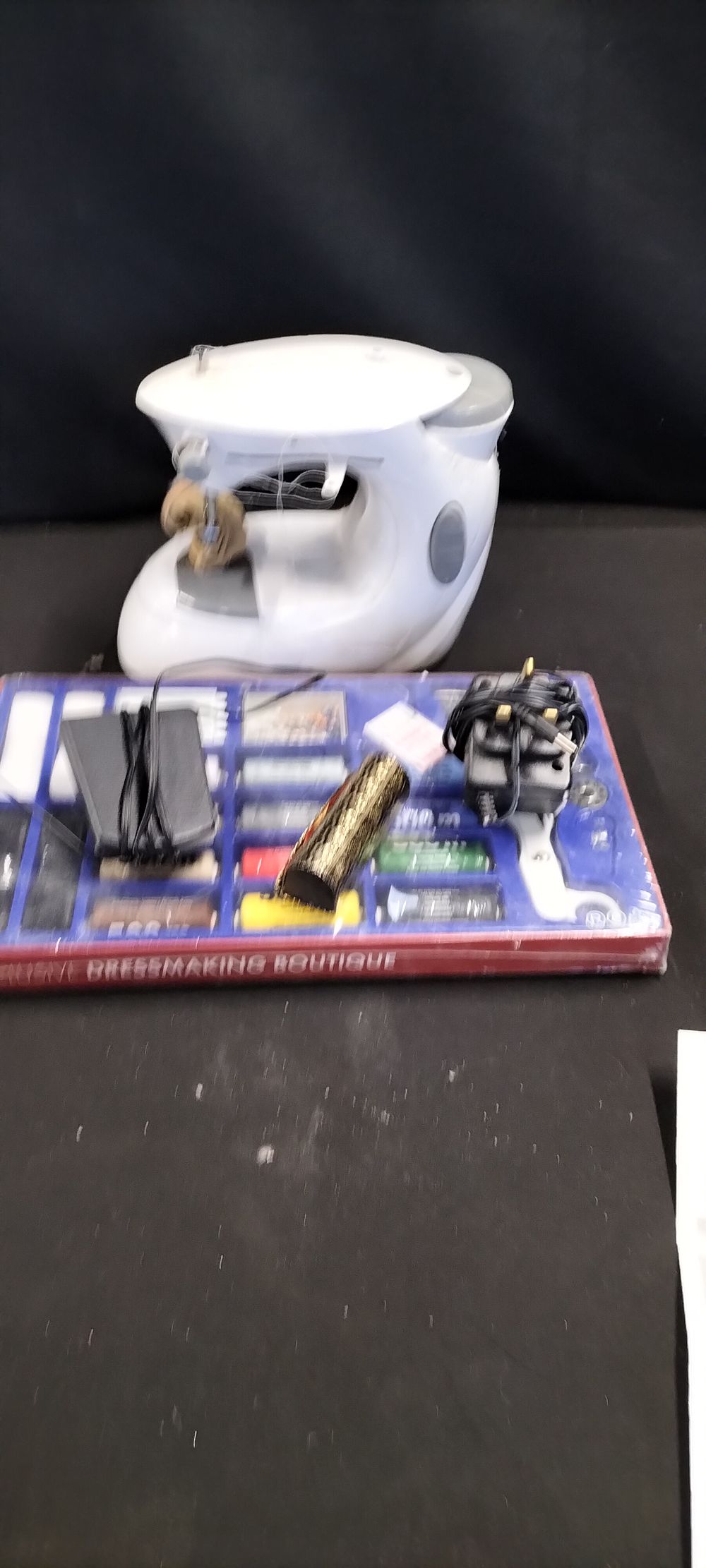 Lot 168: A Mini Sowing Machine and a Dress Making Boutique Accessory Kit