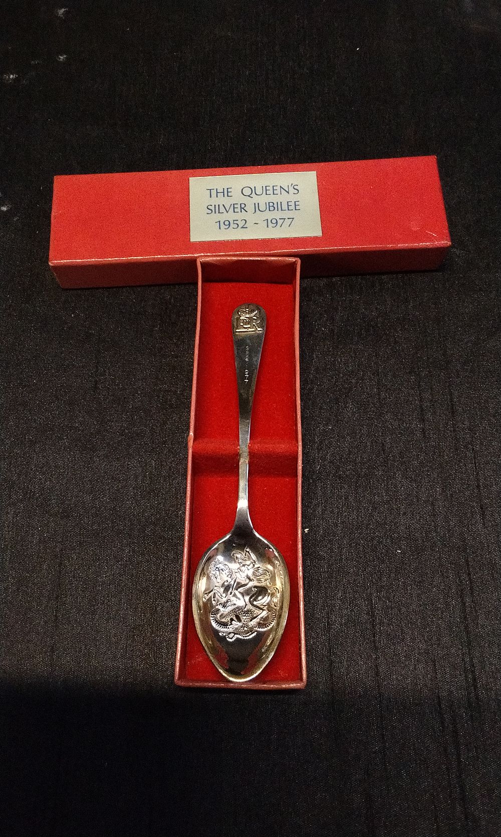 Lot 235: Hallmarked Sterling Silver Teaspoon. Birmingham Date Letter C. 1977. With George and the Dragon Design on the Spoon Base