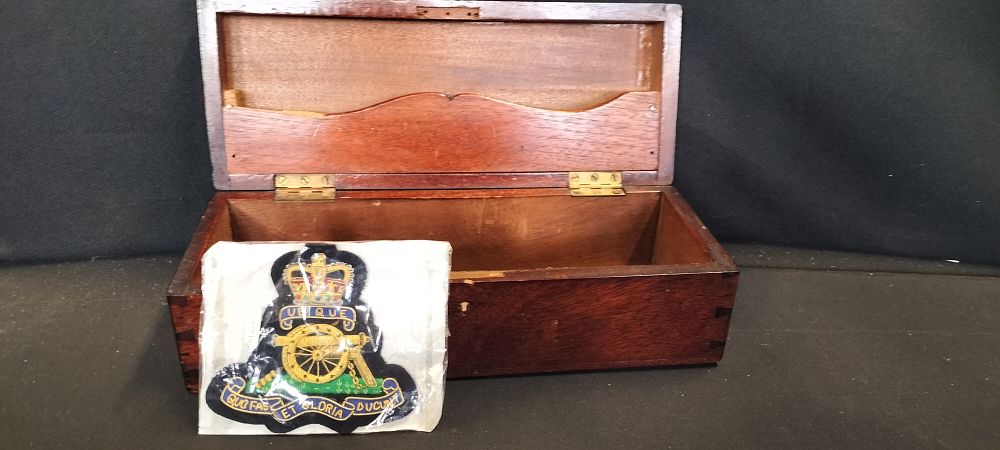 Lot 181: A Royal Artillery Blazer Badge and a Small Wooden Trinket Box