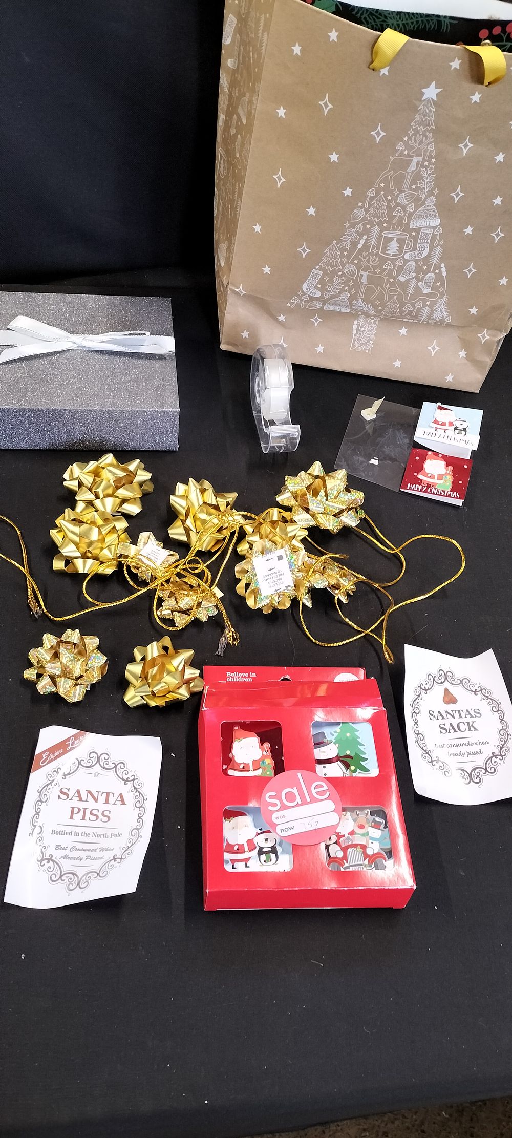 Lot 189: A Selection of Christmas Wrapping Items Including Bows, Tags, Bags and Sellotape