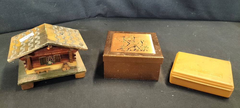 Lot 346: Three Cigarette/Trinket Boxes Including A Musical Chalet and a Polished Copper Lidded Box