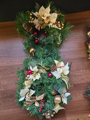 A pair of round decorated weaths