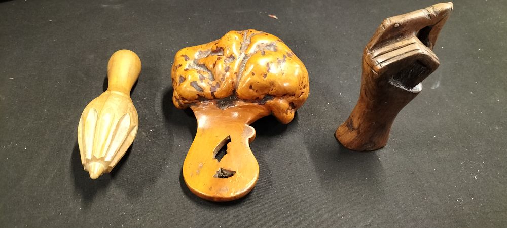 Lot 365: A Vintage Swedish Birch Burl Bowl Scoop, a Lemon/Citrus Reamer and a Hand Carved Hand Sculpture