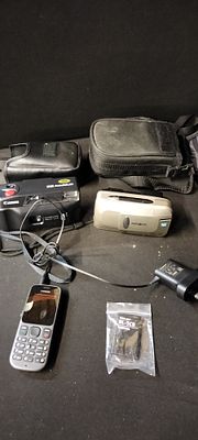 A Nokia 100 with Spare Battery and Charger, Untested, A Canon 35mm Camera plus Case and a 