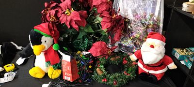 A Box Containing Various Christmas Items Including An Imitation Poinsettia, Christmas Lights 