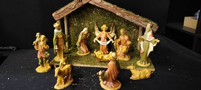 A Traditional Nativity Scene with 11 Figures and a Rendition of a Stable. Figures are Between 4 