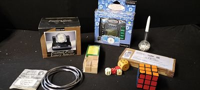 A Collection of Puzzles and Magic Tricks Including Rubik's Cube, Chinese Linking Rings and an 