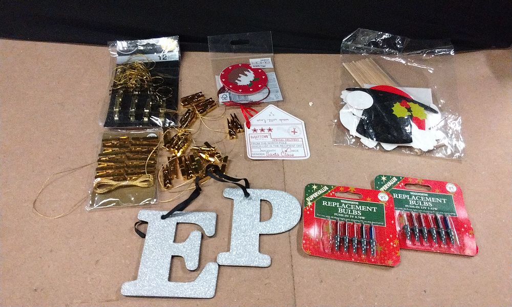 Lot 585: Card Holder Pegs, Gift Tags, Christmas Light Bulbs, and Christmas themed photo booth props.
