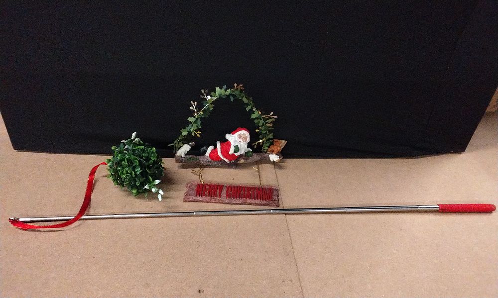 Lot 587: Sexy Santa Hanging Merry Christmas Sign, and a Extendable Ball of Misteltoe