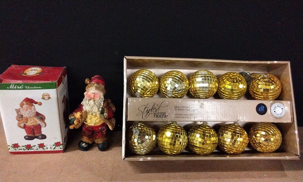 Lot 593: George at Home 10 Light Up Glitter Balls String Light and a Santa Ornament