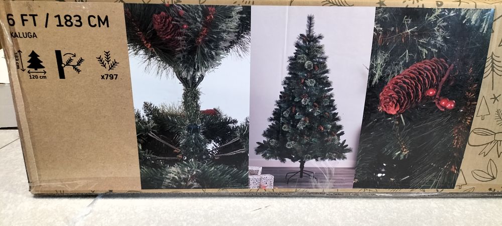 Lot 682: A Kaluga Artificial Christmas Tree with Berry Branches...