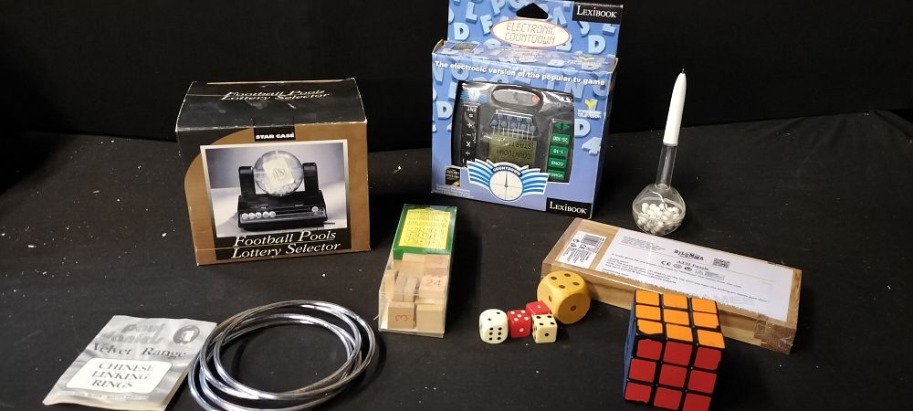 Lot 687: A Collection of Puzzles and Magic Tricks Including...