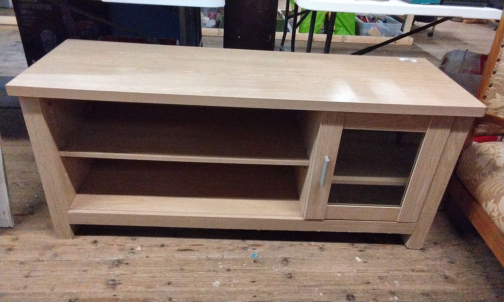 Lot 694: Modern Style T.V. Cabinet With One Shelf and Small Glass Doored Section