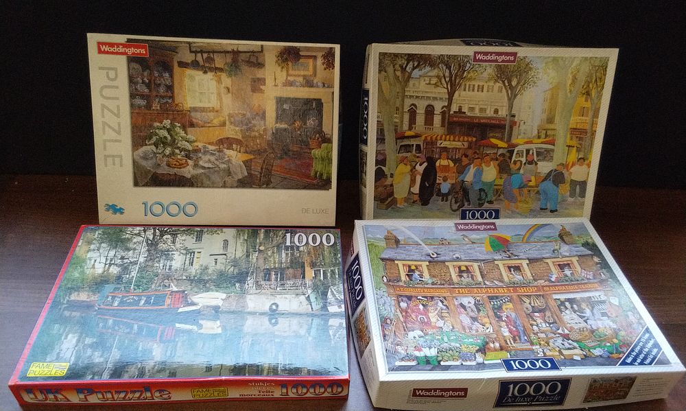 Lot 710: Four Waddingtons 1000 Piece Jigsaw Puzzles