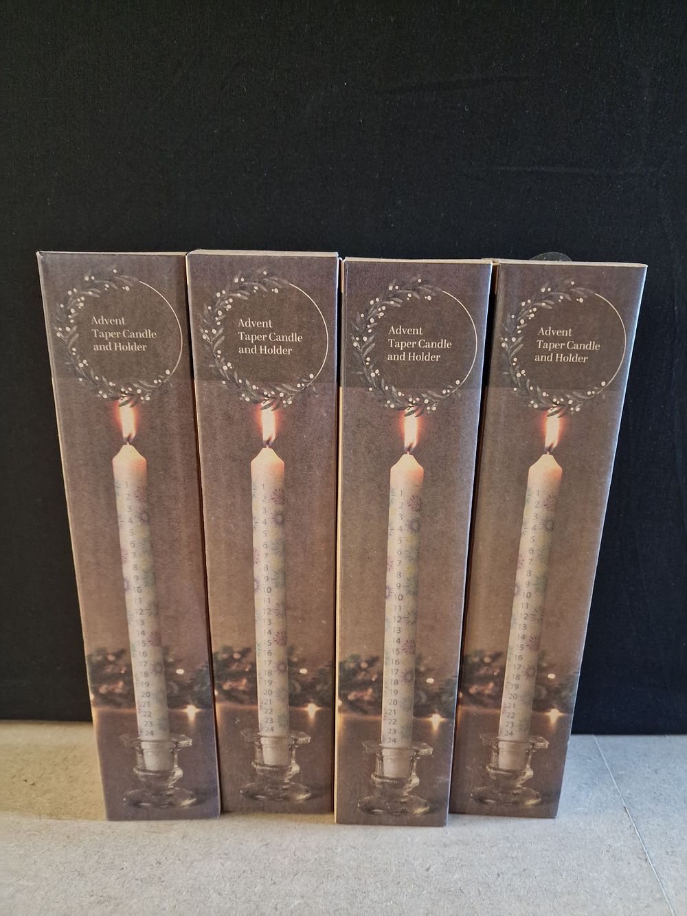 Lot 391: Four Advent Taper Candle and Holder Sets