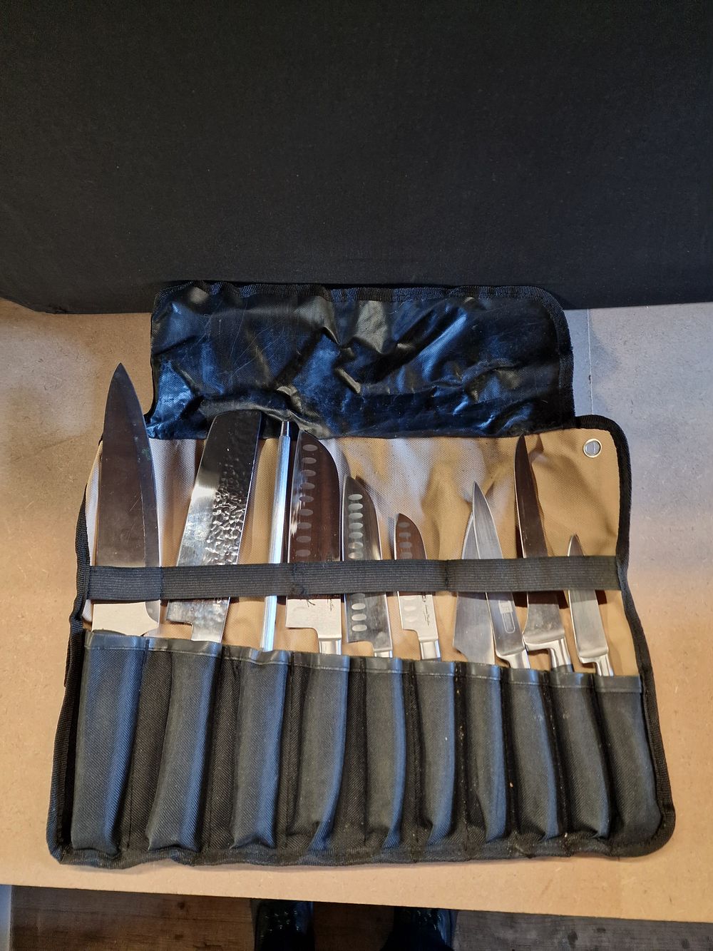 Lot 393: A Set of Eleven Kitchen Knives and Sharpening Steel in Roll