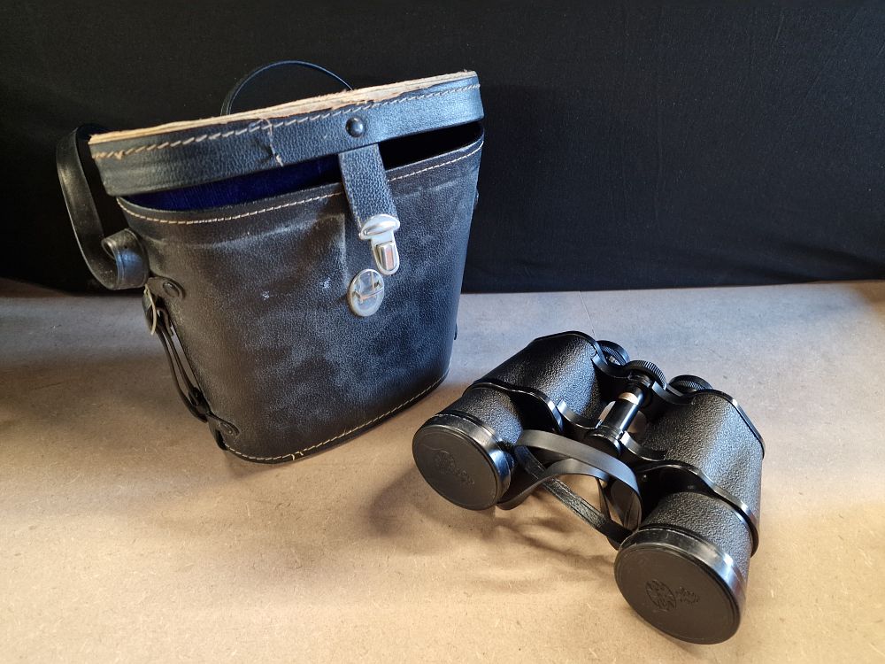 Lot 396: A Pair of Black Tasco 20x50 Binoculars with Case