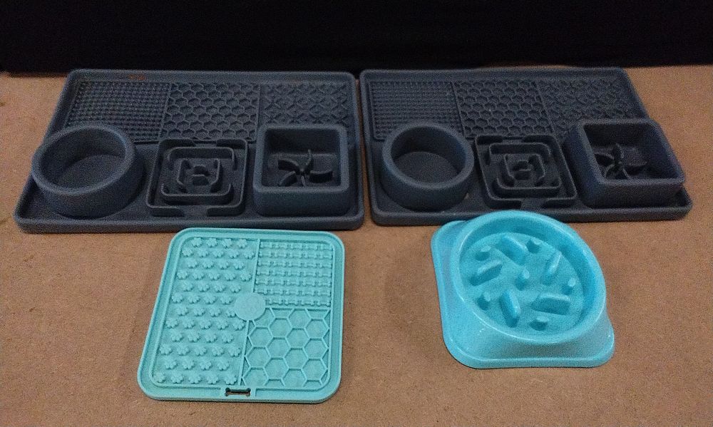 Lot 205: A Group of Contemporary Silicone Pet Lick Mats and Slow Feeders