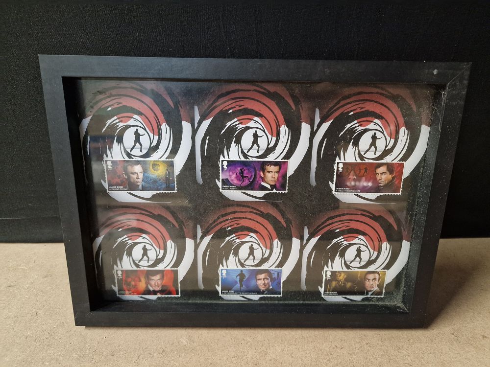 Lot 308: Six Framed James Bond Themed Postage Stamps