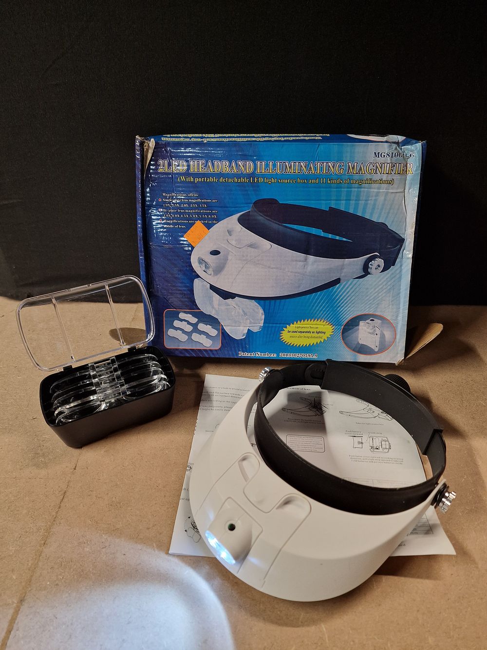 Lot 309:  LED Headband Illuminating Magnifier with Lenses