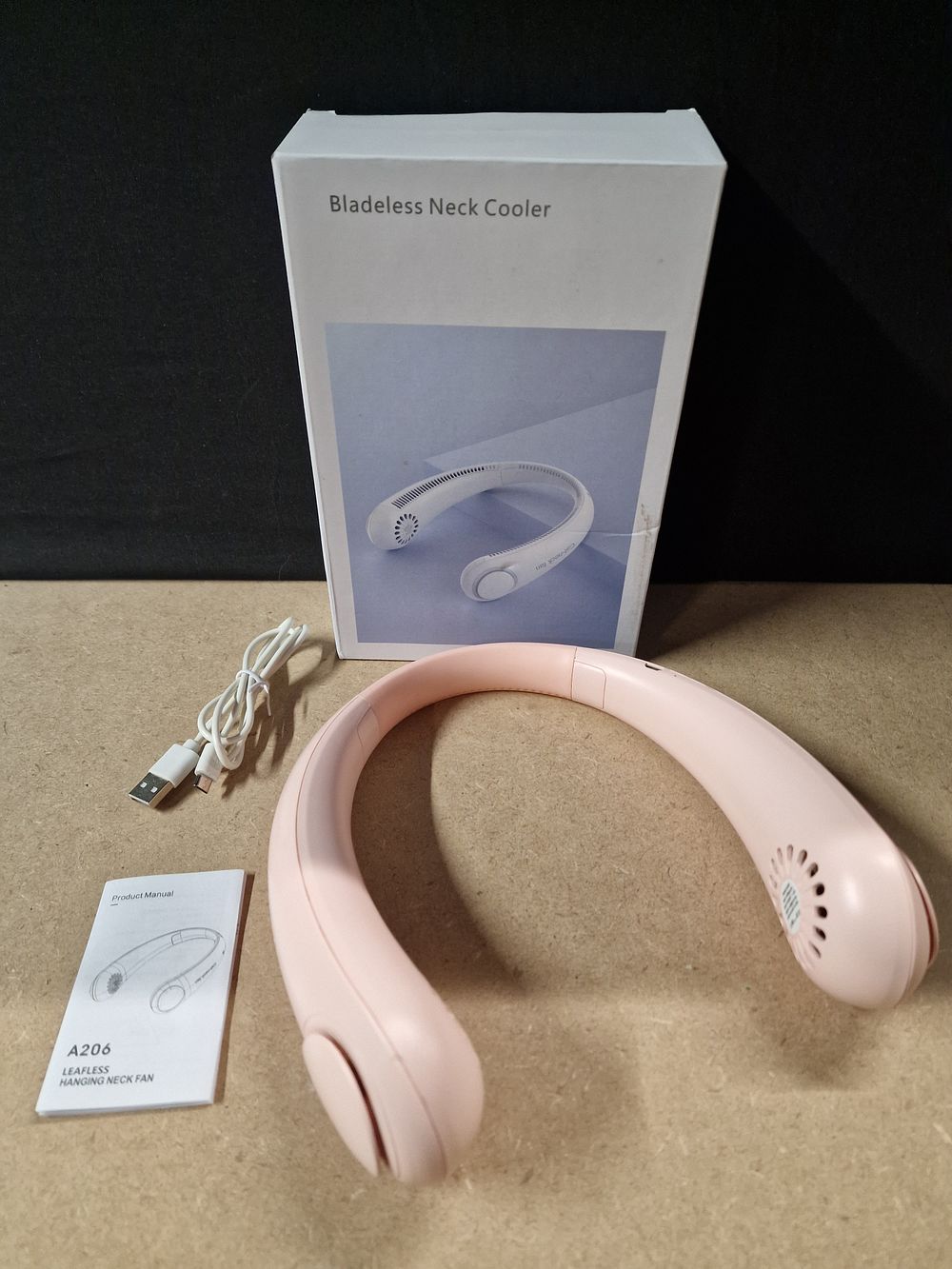 Lot 310: Pink Bladeless Neck Fan with Box and USB Cable