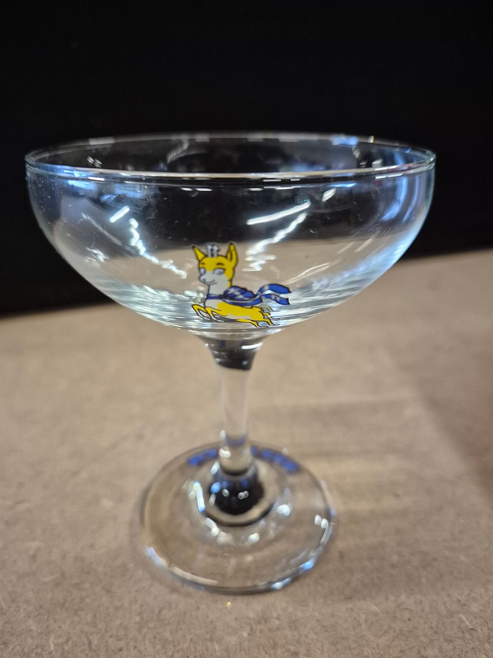 Lot 214: A Set of Six 1970s Yellow Fawn Babycham...
