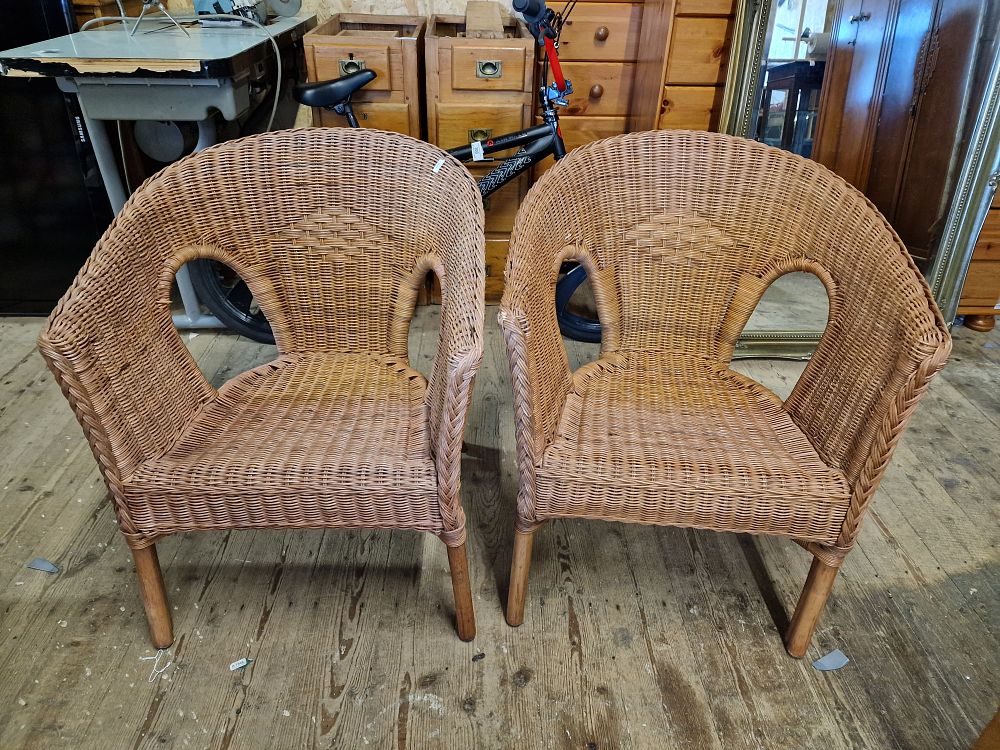 Lot 325: A Pair of Light Brown Wicker Chairs
