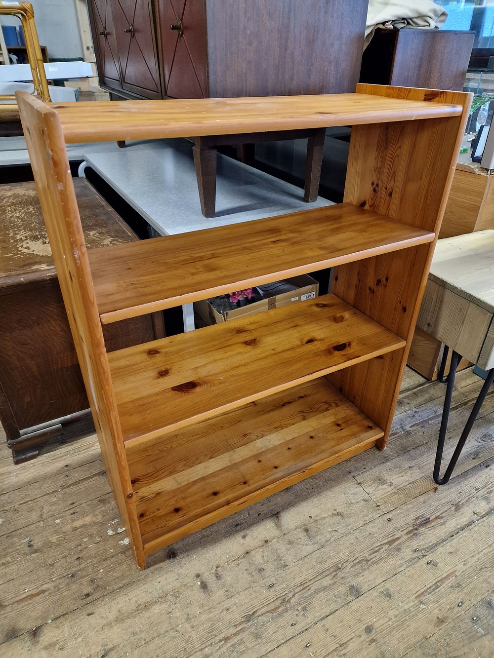 Lot 326: One Light Brown Four-Shelf Wooden Bookshelf