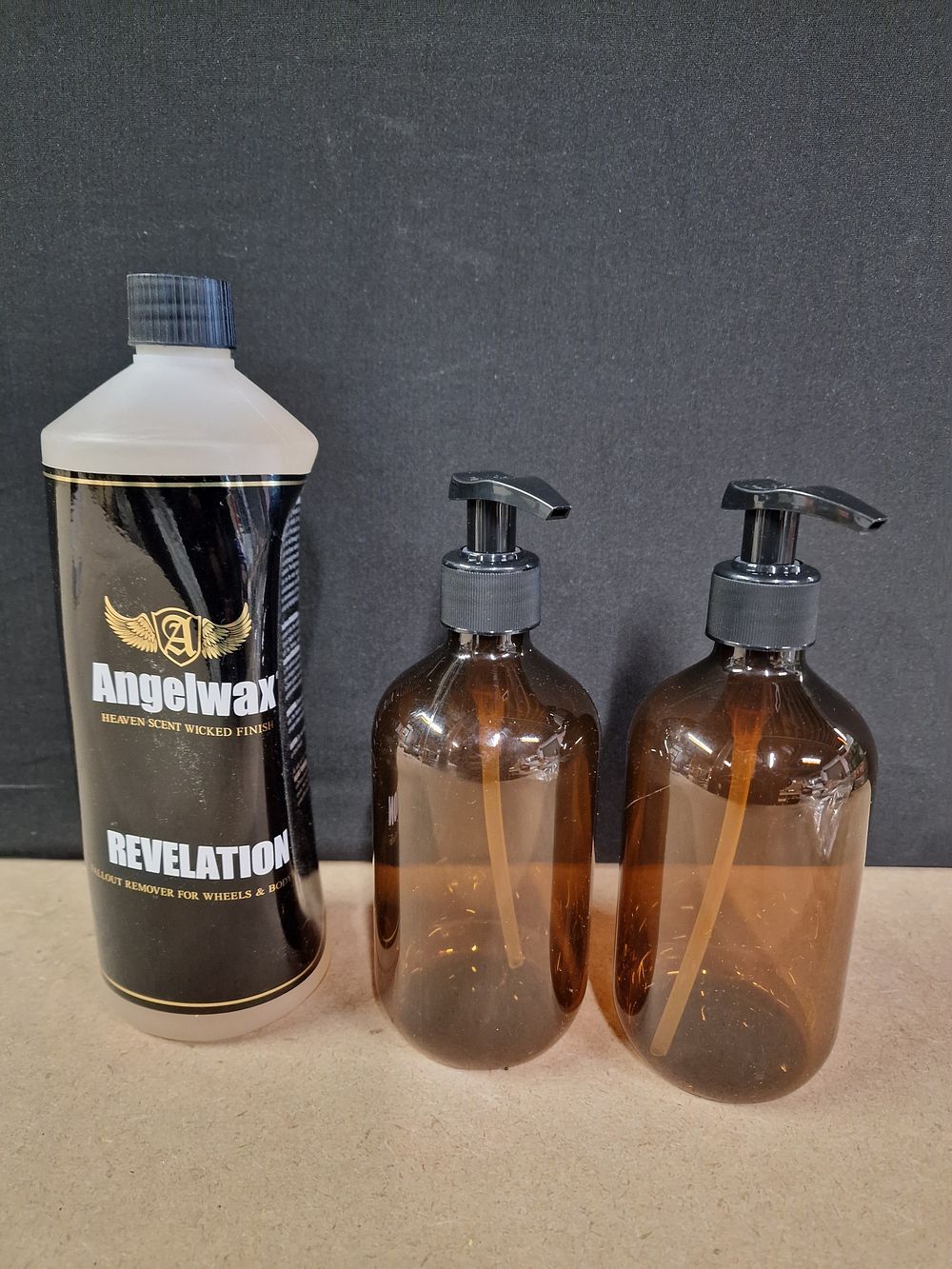 Lot 334: Three Bottles: Angelwax Remover and Two Amber Pump Dispensers