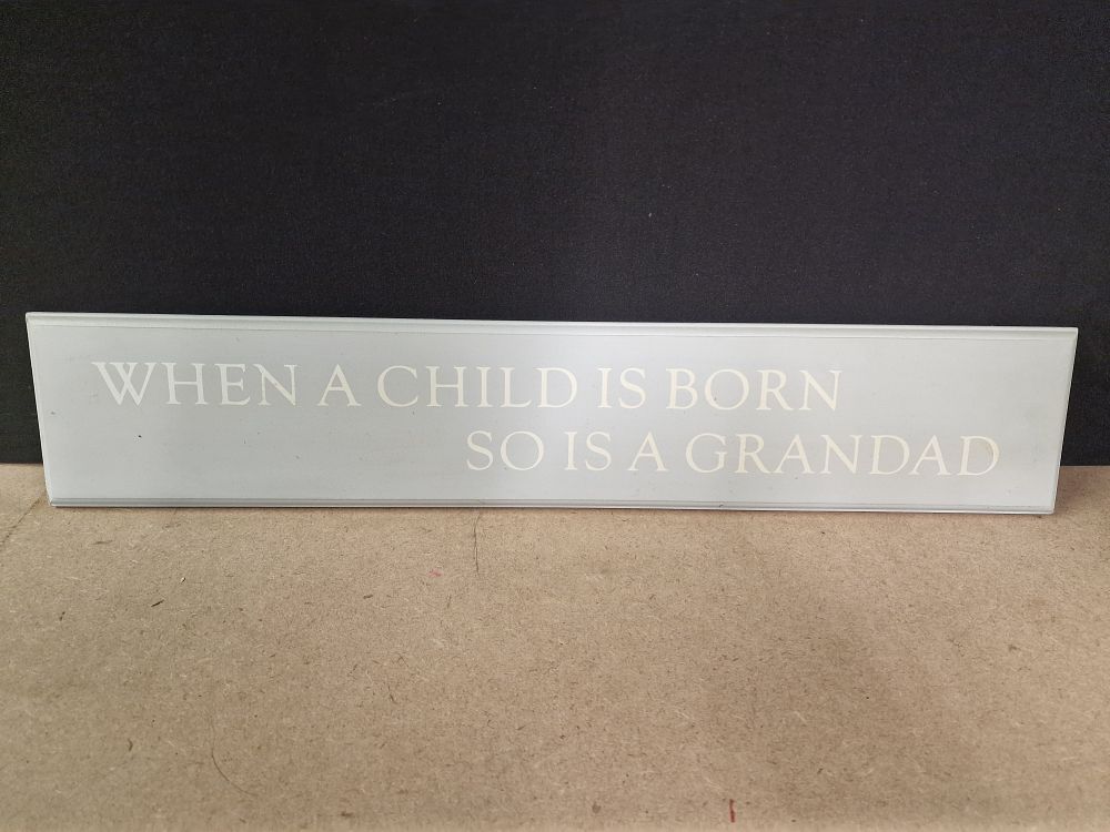 Lot 338: A Light Gray Decorative Sign 'When a Child is Born' 58cm