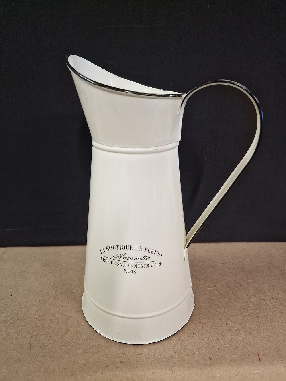 Lot 340: A Cream Enamel Pitcher with 'La Boutique De Fleurs' Inscription