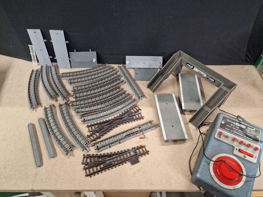 Lot 358: A Collection of OO Gauge Model Train Tracks, Platforms, and Power Unit