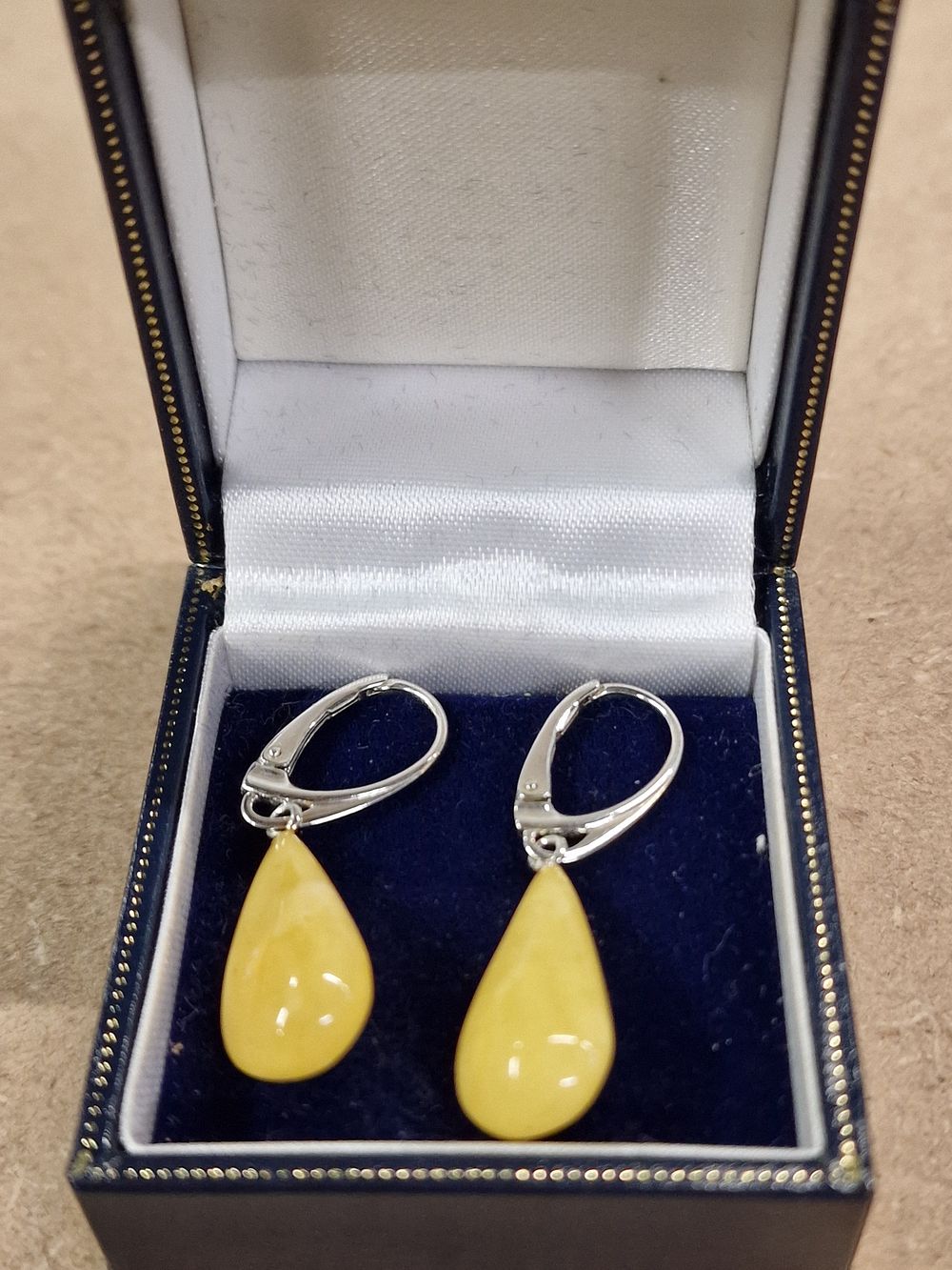 Lot 374: A Pair of Baltic Amber and Sterling Silver Drop Earrings