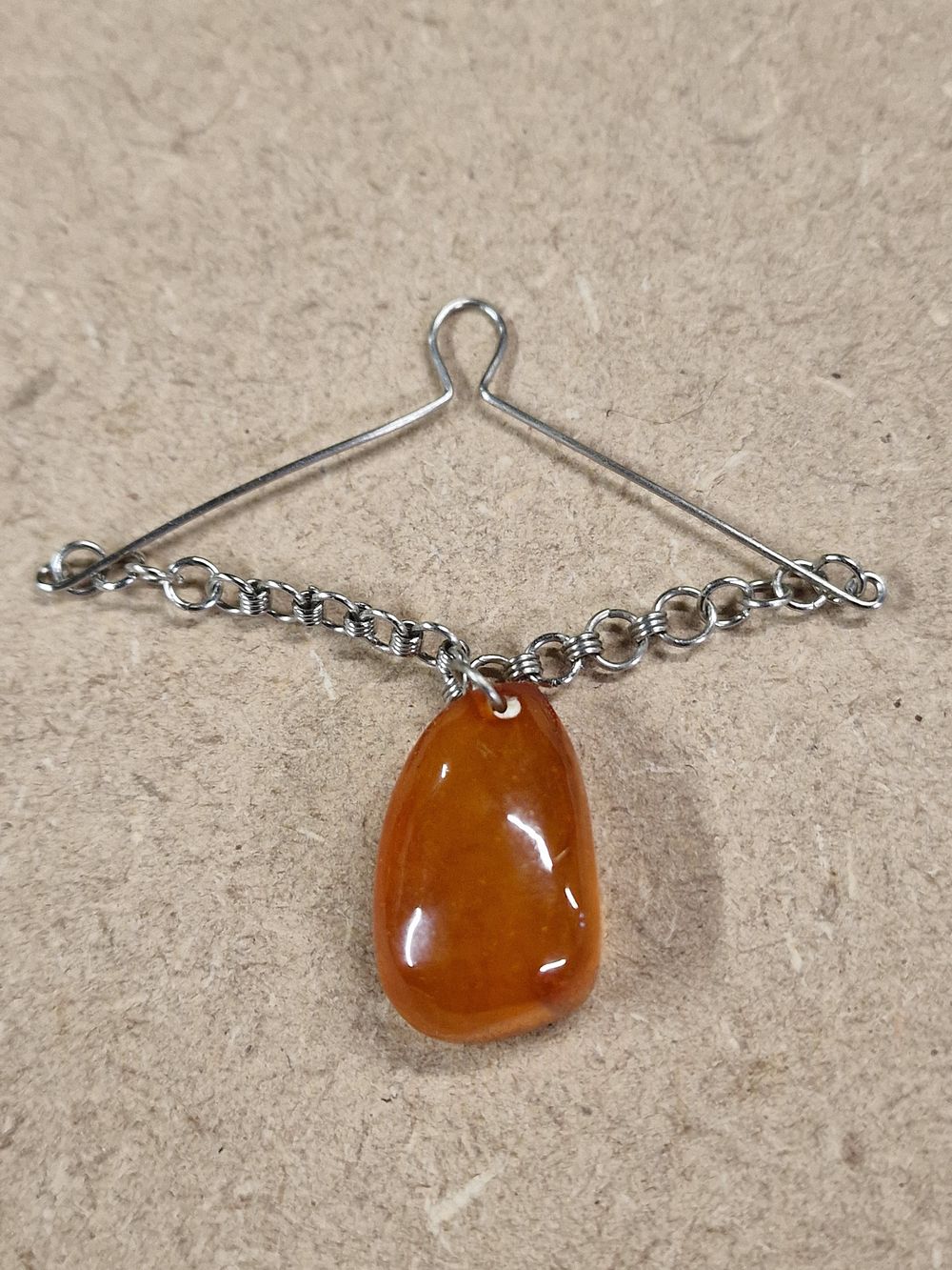 Lot 375: Old Amber Brooch with Teardrop Pendant