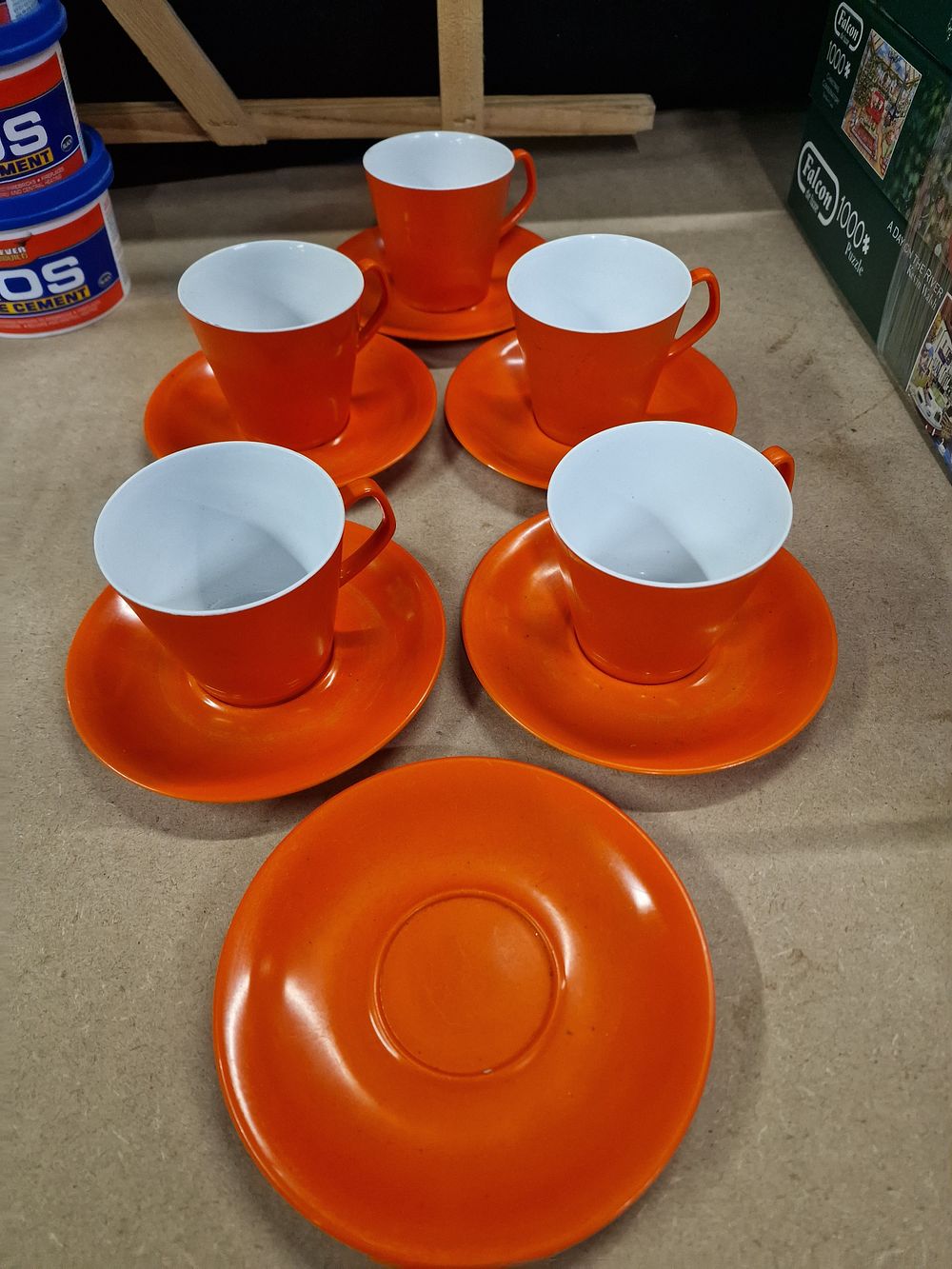 Lot 379: A Set of Brentware Orange Cups and Saucers