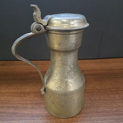 Antique Pewter Lidded Tankard or Pitcher. A single vintage or antique lidded metal tankard or 