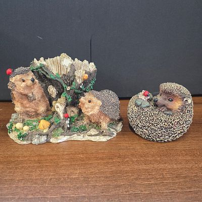 A Pair of Decorative Resin Hedgehog Figurines Made in China. A Pair of decorative brown and gray 