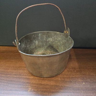 Antique Spun Brass Bucket Pail with Forged Iron Handle. A single tarnished, dark grey-brown 