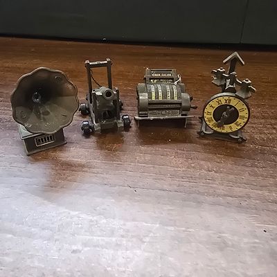 A Collection of Four Die Cast Metal Novelty Pencil Sharpeners. A Collection of 4 dark 