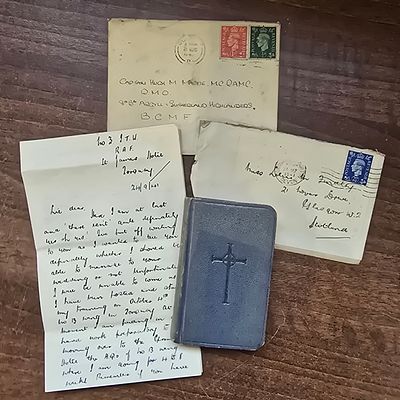 Collection of Four WWII Correspondence Pieces and Devotional Booklet. A Collection of 4 items 