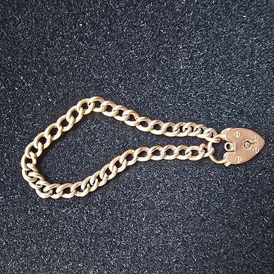 Cr1900-20 9k Gold Heart Lock Curb Bracelet with stamped links. A collection of two items 