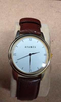 Aramis Analog Quartz Wristwatch Gold Tone Case Brown Leather Strap. This is a classic 